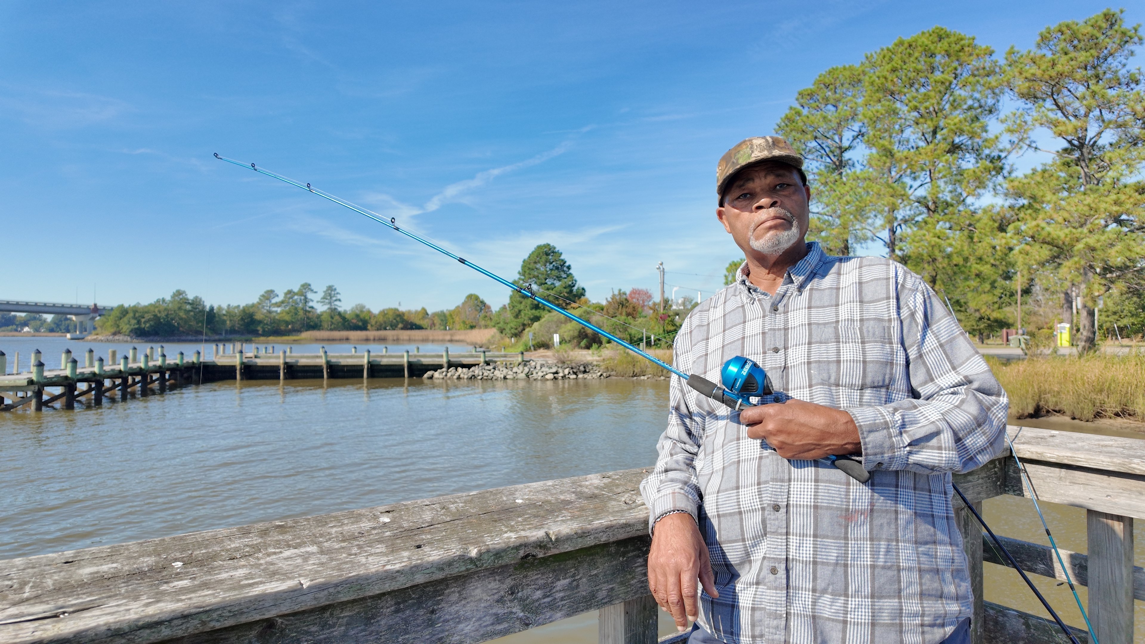 Man fishing off the West Point pier